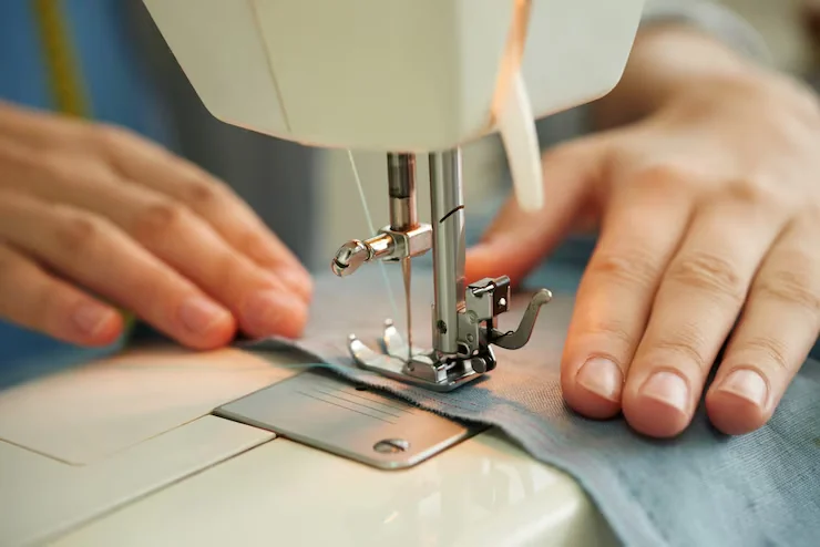 Garment stitching at an industrial sewing machine